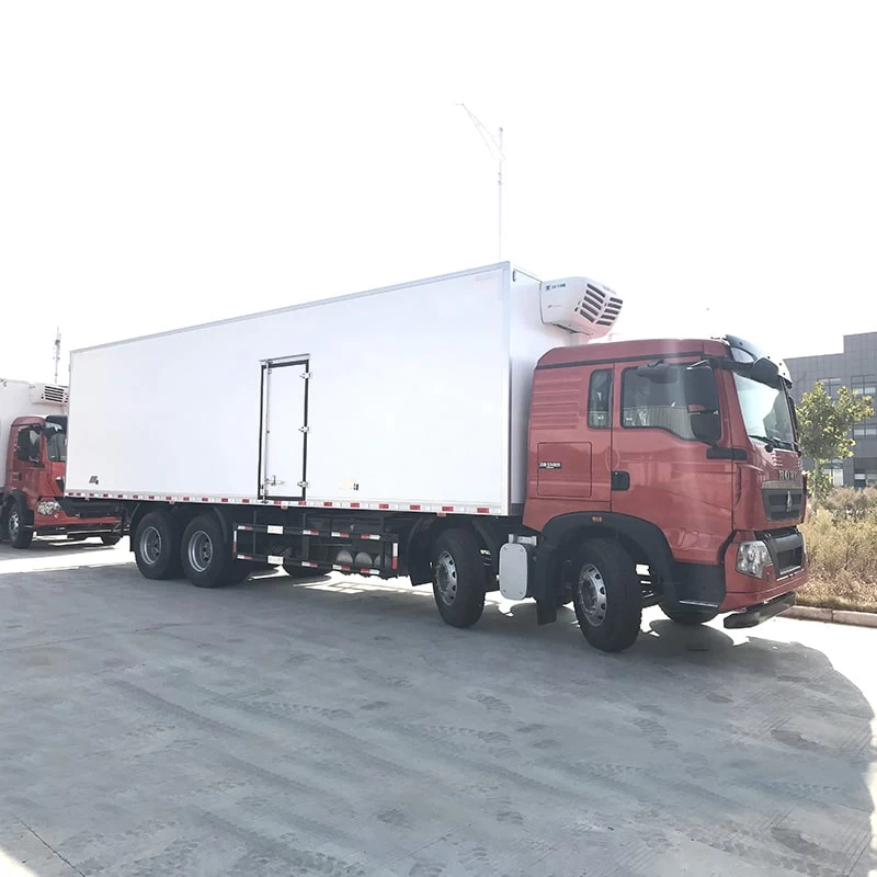 SINOTRUK HOWO 8*4 big capacity 56m3 refrigerator trucks Oblique Front View