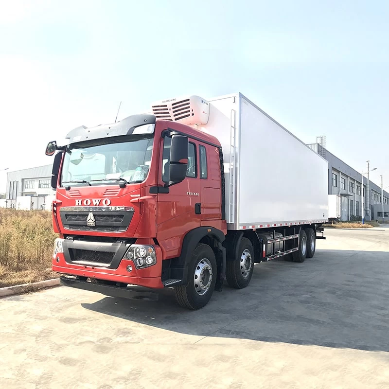 SINOTRUK HOWO 8*4 big capacity 56m3 refrigerator trucks Oblique Front View