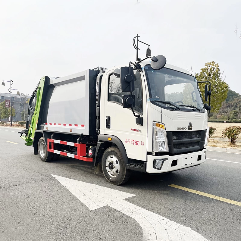 SINOTRUK HOWO 4*2 sanitation compressed garbage truck Oblique front view