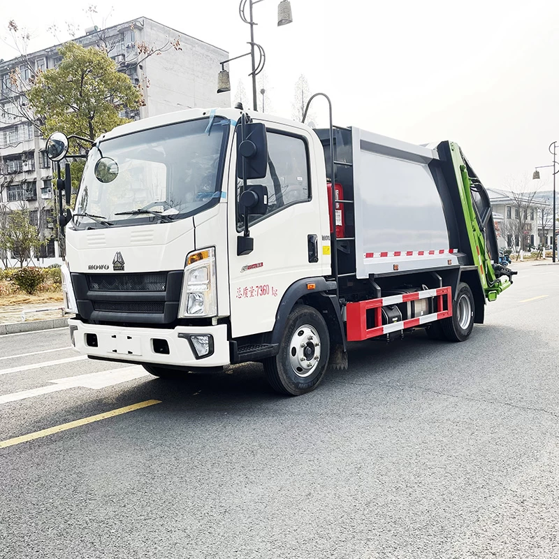 SINOTRUK HOWO 4*2 sanitation compressed garbage truck Oblique front view